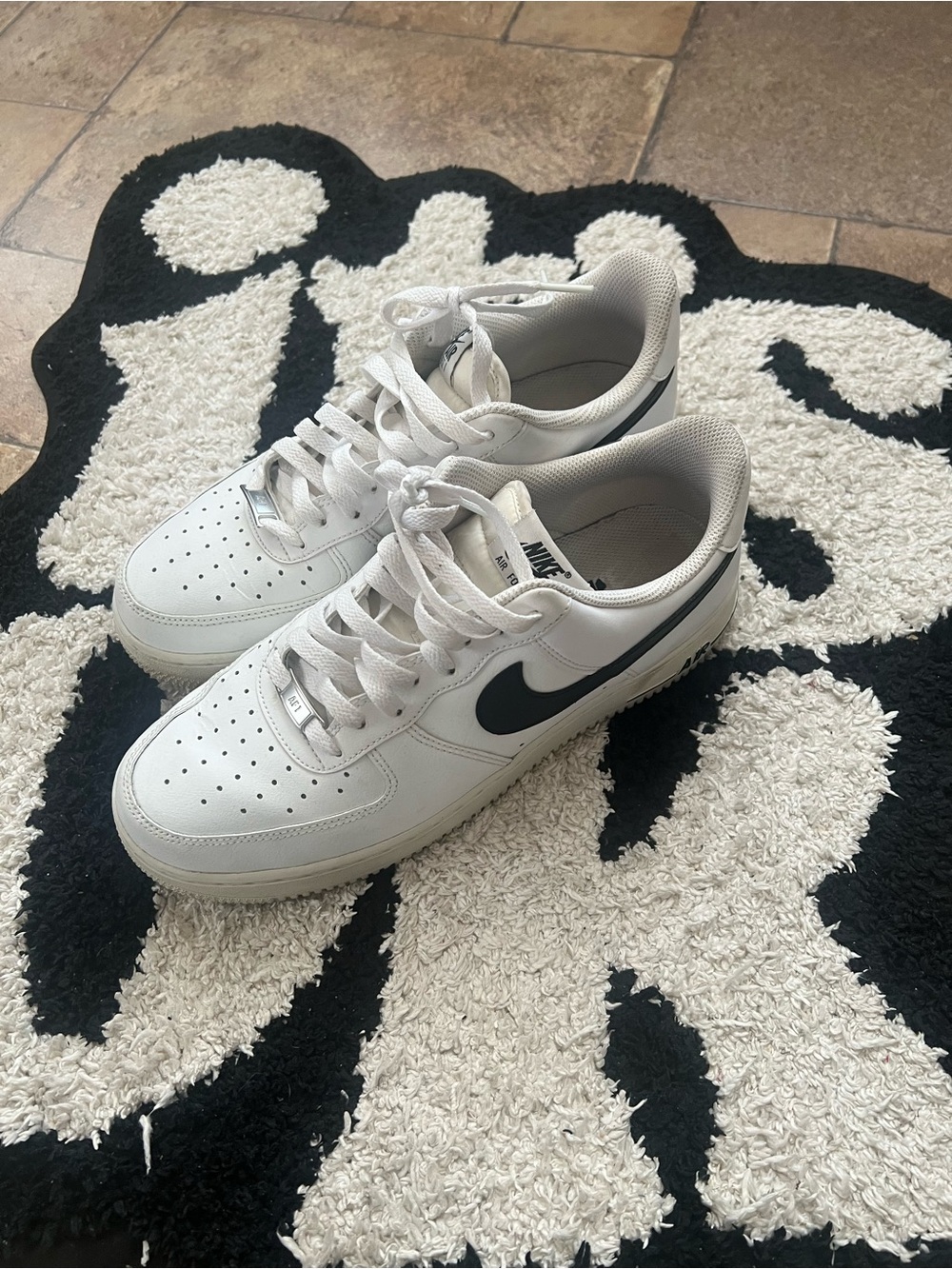 Nike White Low-Top Sneakers with Black Swoosh